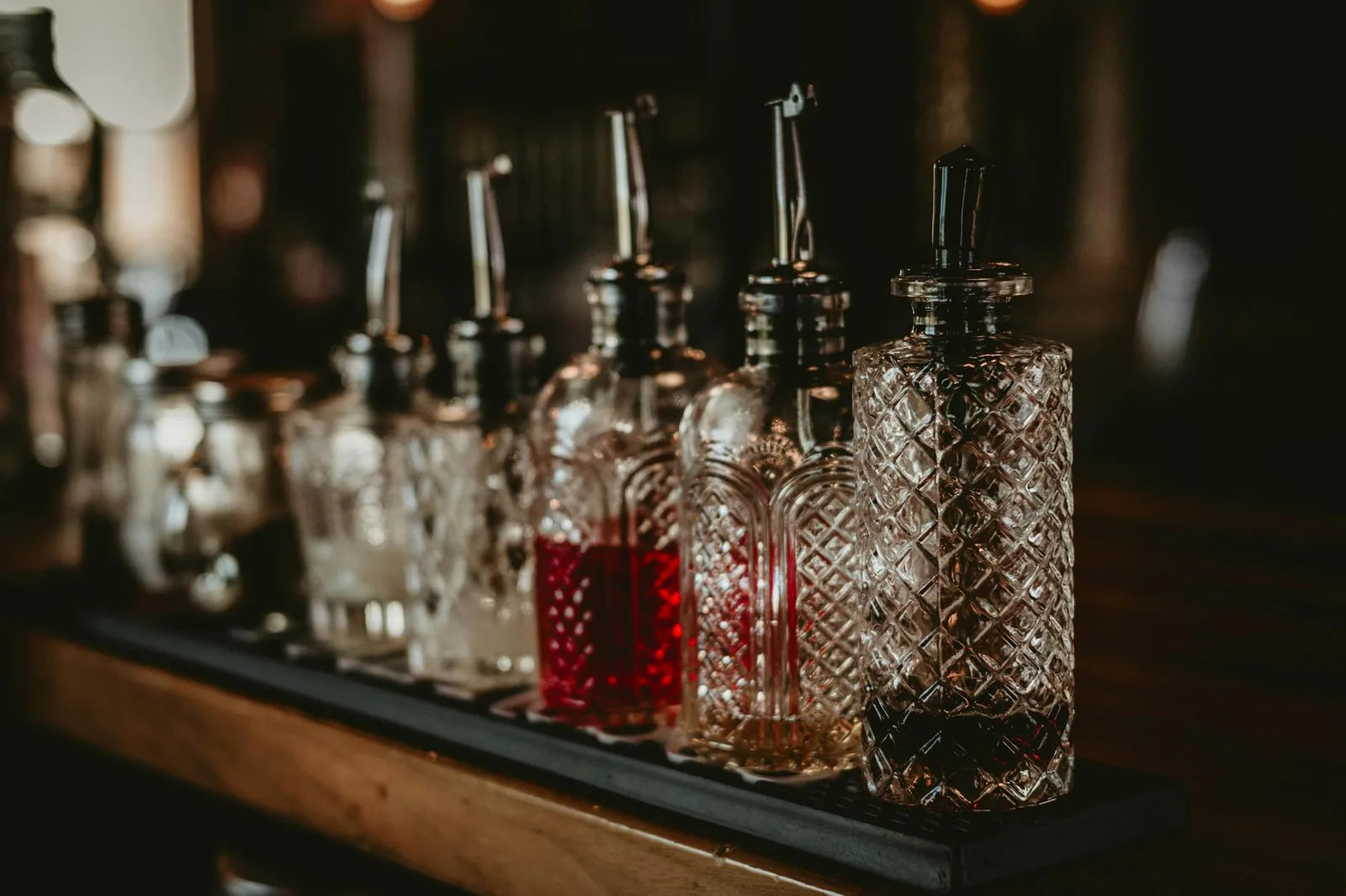 Retro bar counter, crystal glasses, amber light
