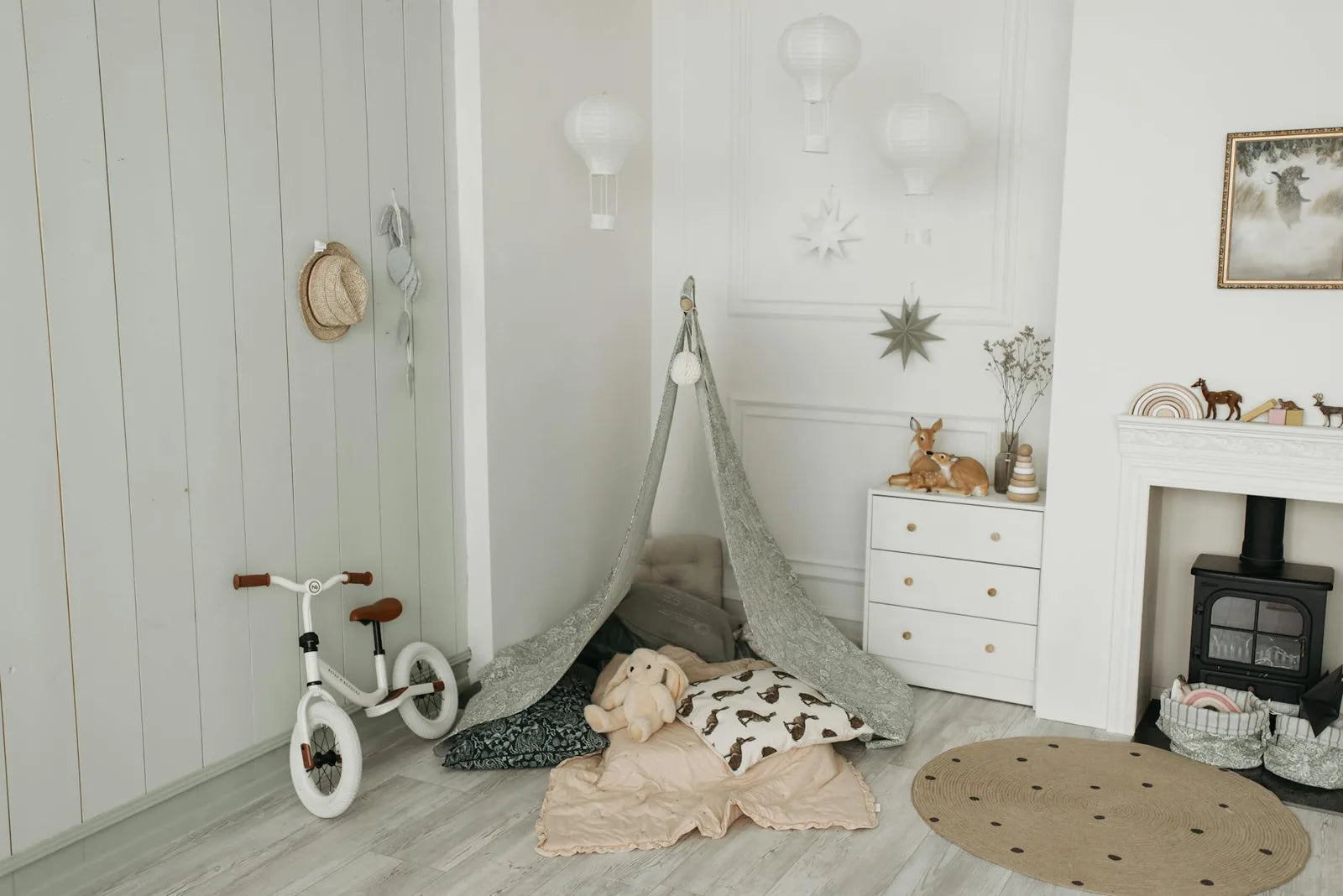 Scandinavian child's bedroom with a colourful poster on the wall