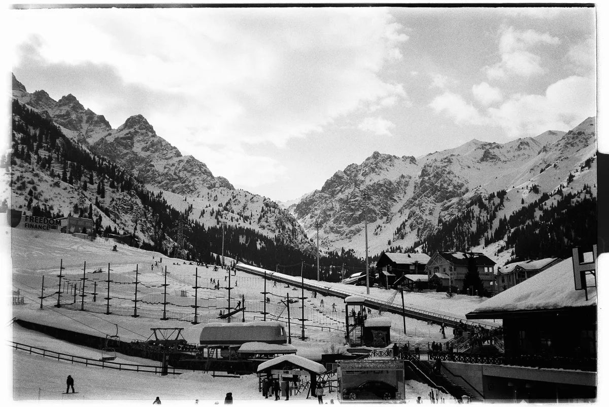 Vintage ski resort, snowy slopes, wooden chalet