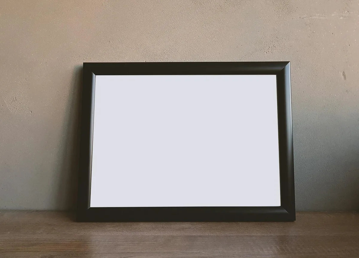 Matte black frame on a white wall, minimalism