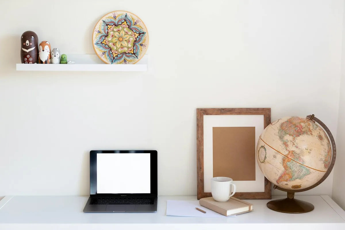 Small poster above a desk, intimate workspace