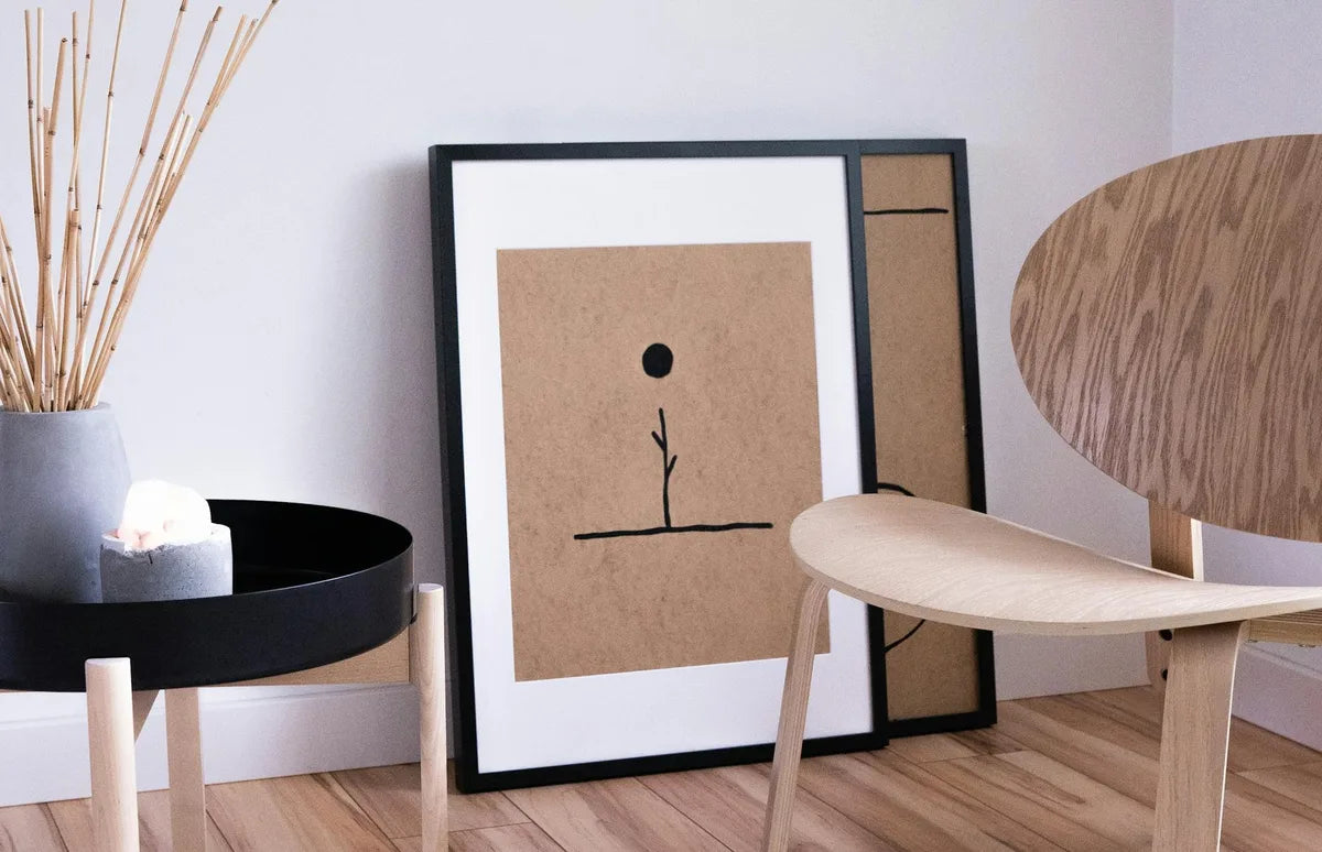 Japandi-style living room, light wood, green plant, one large poster
