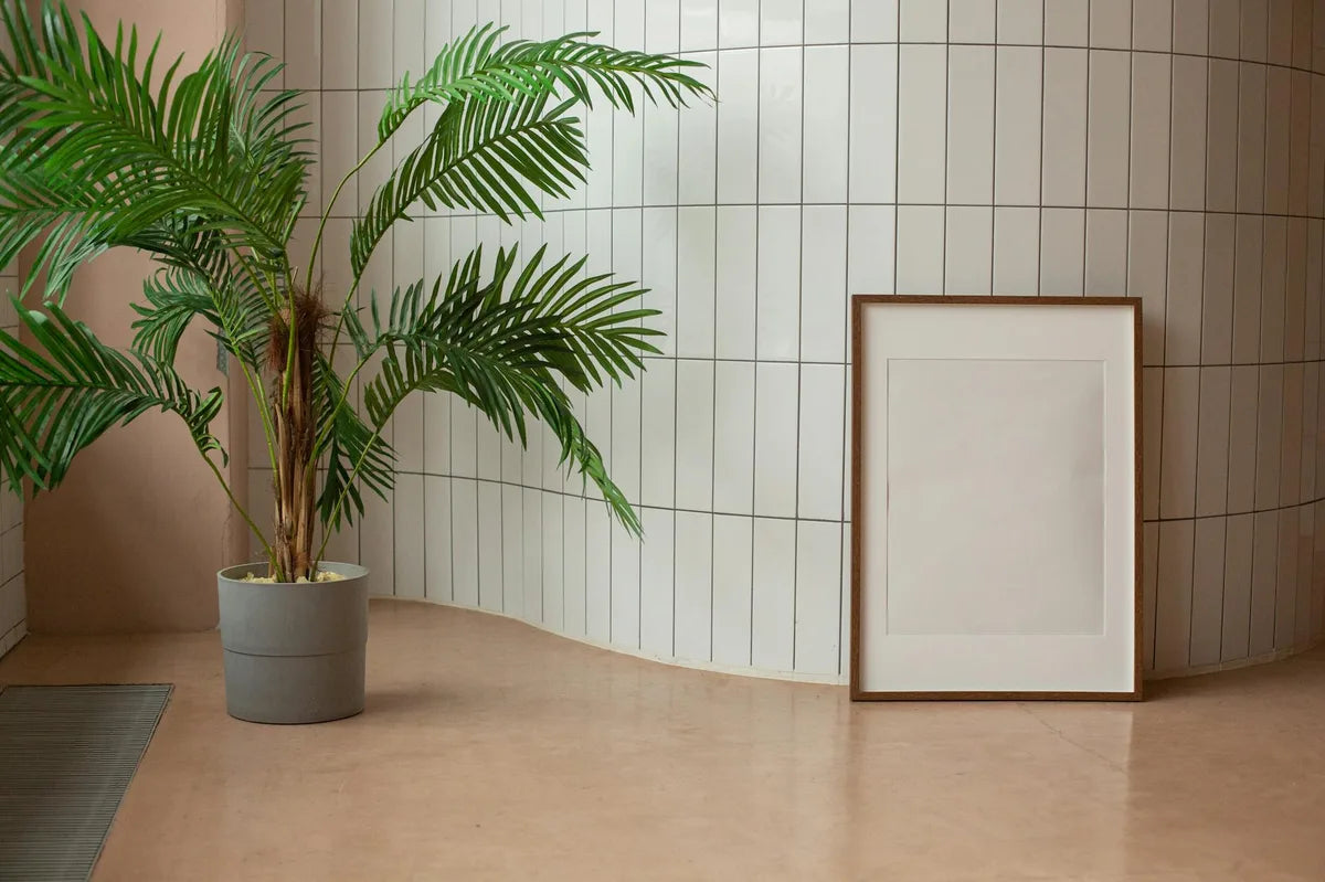 Living room wall with five posters in green and beige tones