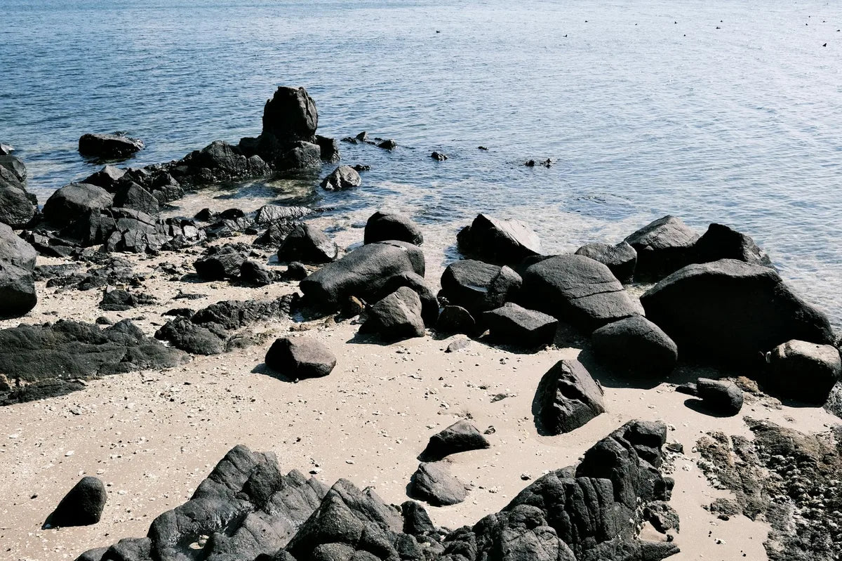View of the sea from a rocky coast, raking light